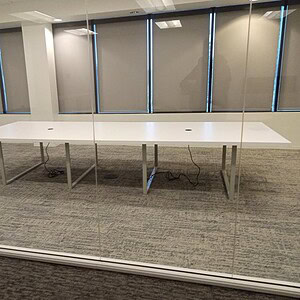 Herman Miller powered table with steel base, ideal for modern office setups.