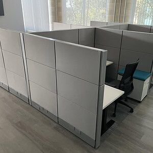 Modern Herman Miller Ethospace cubicles in silver for office spaces.