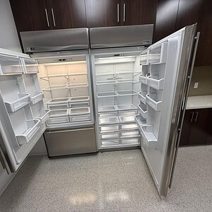 G.E. Monogram 720 commercial fridge and freezer with spacious interior and adjustable shelves.