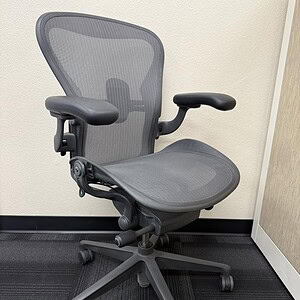 Aeron B Graphite ergonomic office chair with interwoven mesh for comfort and support.