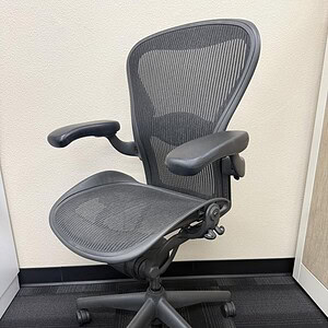 Aeron B ergonomic office chair in black graphite with mesh back and seat, ideal for modern workspace.