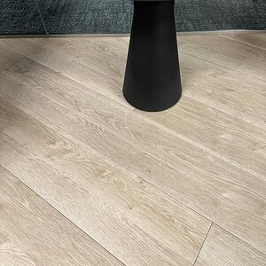 Black round occasional table for modern interior spaces.