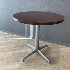Round espresso wood table with steel base, ideal for modern office or dining spaces.