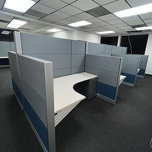 Office cubicles with silver and navy accents for modern workspace efficiency.