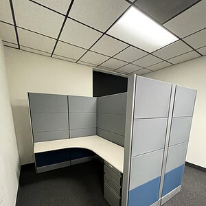 Tall Ethospace cubicle with high privacy panels for office separation.