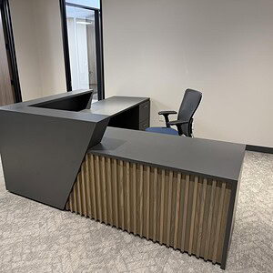 Vito Natural Onyx desk with modern black and wood accents, perfect for professional office settings.