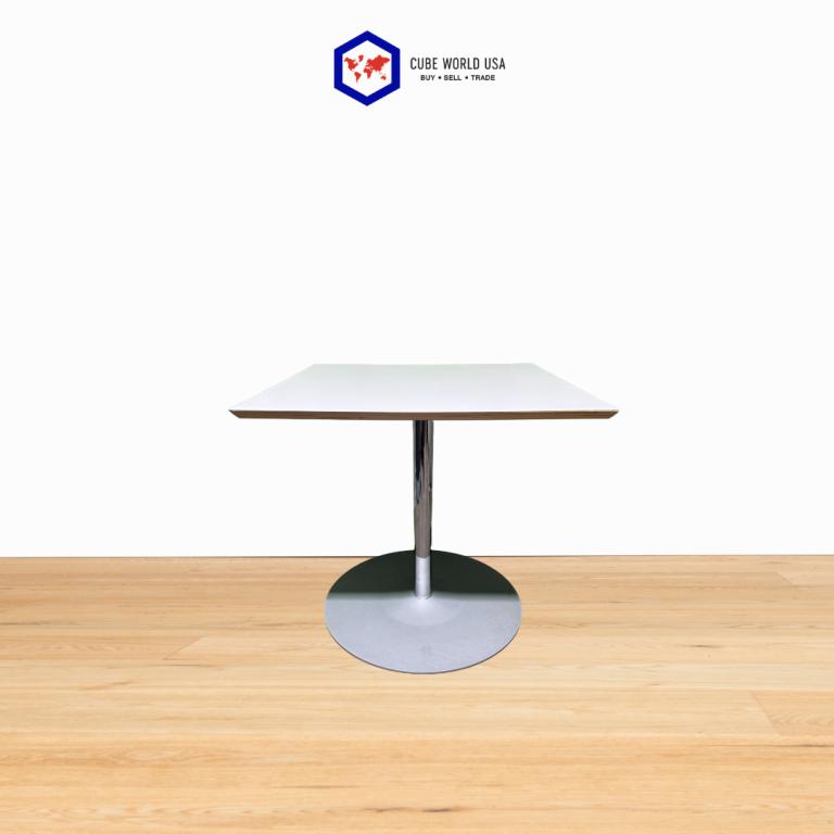 Herman Miller 30-inch white table with chrome base, ideal for contemporary work environments.
