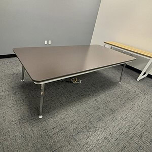 Herman Miller Eames powered table 8x4 with rounded edges, ideal for modern office spaces.