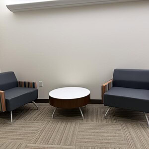 Modern Kimball Sunset Blue Lounge Chair in minimalist office setting.
