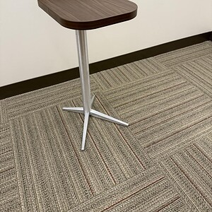 Kimball occasional table featuring a wood top and silver metal base.