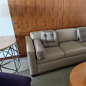 Elegant Bernhardt leather sofa with neutral tones, perfect for sophisticated living room decor.