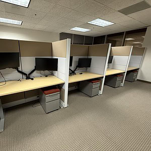 Ethospace call center cubicles with dual monitors and ergonomic desks.