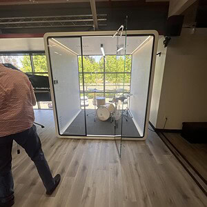 Glass privacy pod for meetings and collaboration.