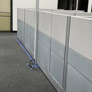 Modern office cubicle partitions for workspace organization and privacy.