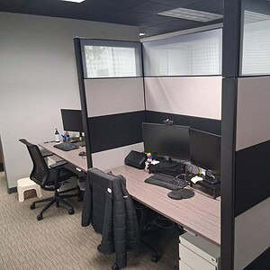 Ethospace 86inT acoustical desk with privacy panels and workspace setup.