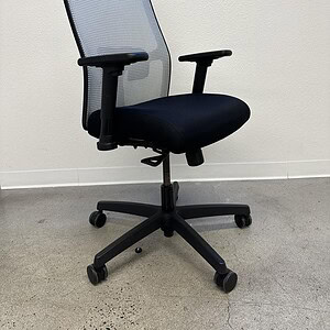 Ergonomic mesh office chair with adjustable armrests and black fabric seat, ideal for workspace comf.