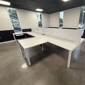 Herman Miller 5.5x5.5ft white benching desk with privacy panels, ideal for modern office workspaces.