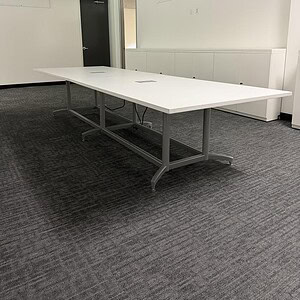 Powered conference table for modern office spaces. Perfect for meetings and collaborative work envir.