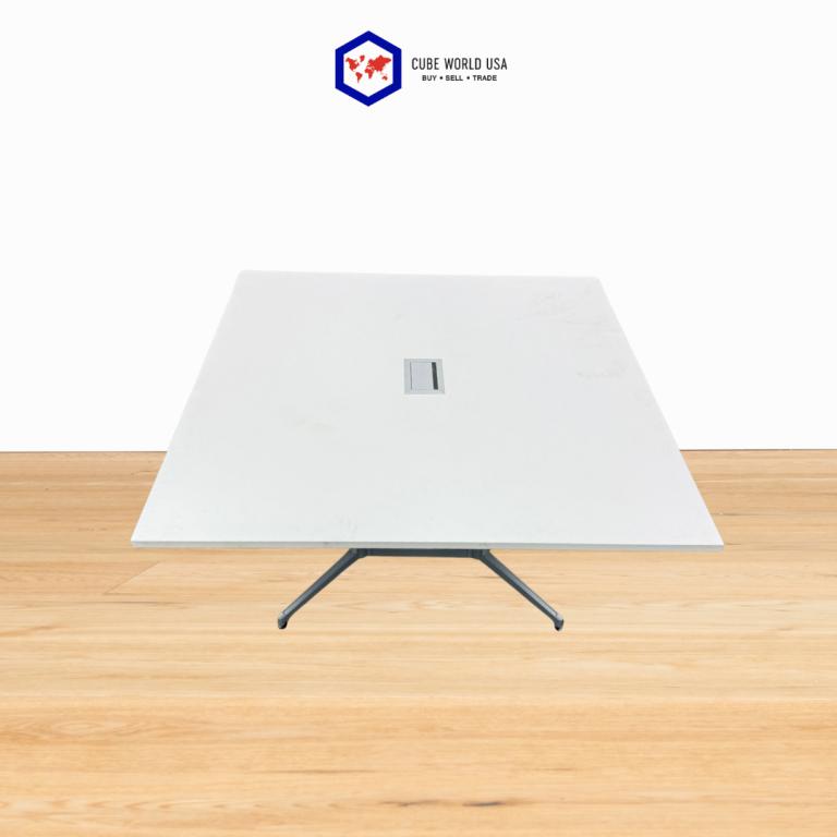 Haworth powered 5x5 table with silver base, modern office furniture for productivity.
