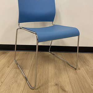 Sky Blue 9 to 5 Kelley stacking chair with metal frame for office or conference room use.