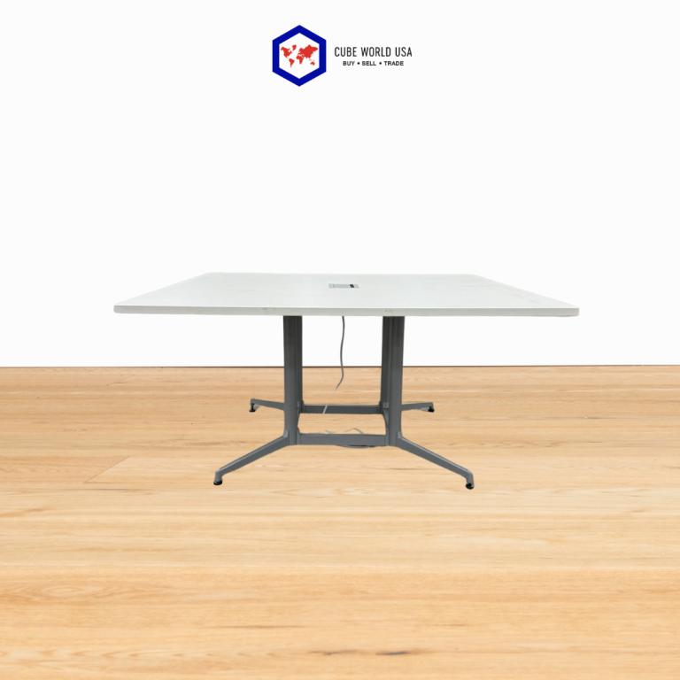Power 5x5 Haworth table with sleek silver base for modern office spaces.