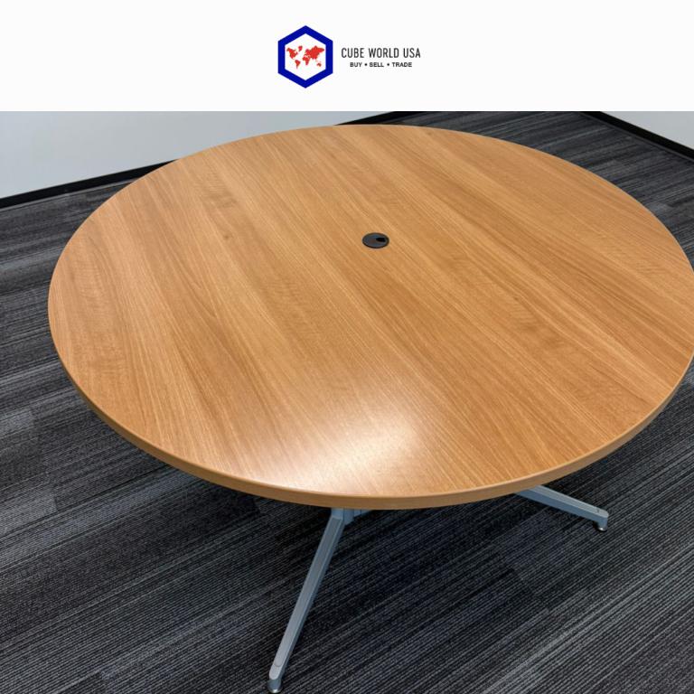 Haworth 54" diameter maple top conference table with silver base, ideal for modern office settings.