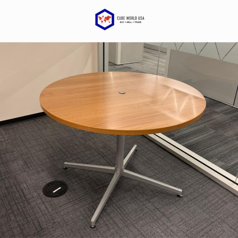 Haworth 42-inch diameter maple top table with sleek silver base, ideal for modern office or conferen.