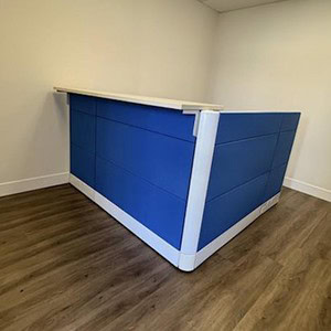 Herman Miller tall reception desk with blue panels and white accents.