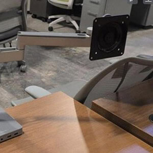 Dual monitor arms with USB and HDMI connectivity for ergonomic workspace setup.