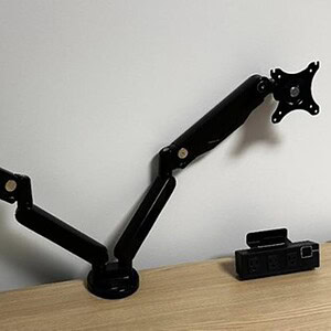 Dual monitor desk mounts for ergonomic workspace setup.