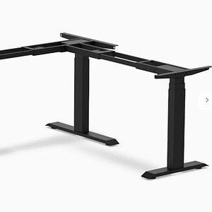 Black L-shaped height adjustable desk base for ergonomic office setups.