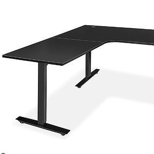 Office desk with black Wilson Art surface and sturdy black metal frame.