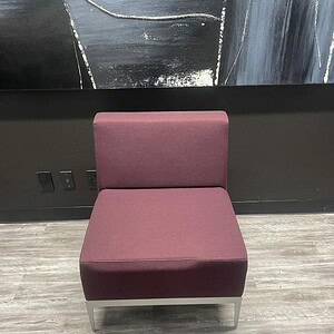 Modern purple lounge chair with metal frame, stylish and comfortable seating option.