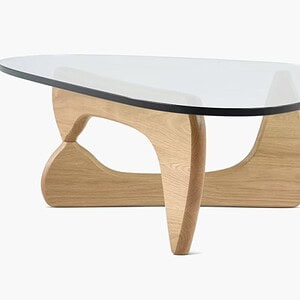 Elegant Noguchi coffee table with white glass top and natural oak base.