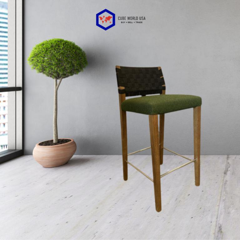 Modern black woven back counter stool with wooden legs and green cushion.