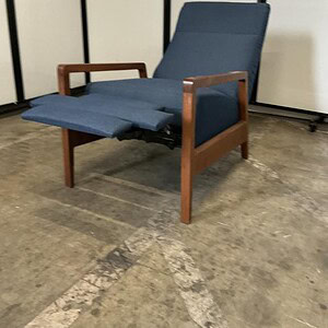 Blue lounge recliner with wooden veneer accents, perfect for contemporary living spaces.