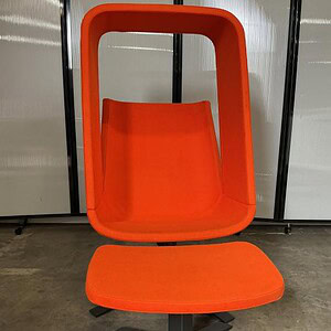 Orange Haworth Windowseat lounge chair for modern office or home workspace.