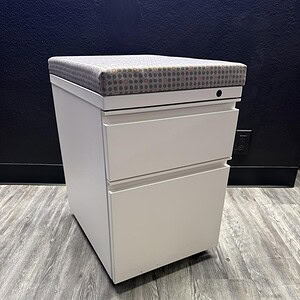 Herman Miller BF Mobile Pedestal in white and grey with fabric top.