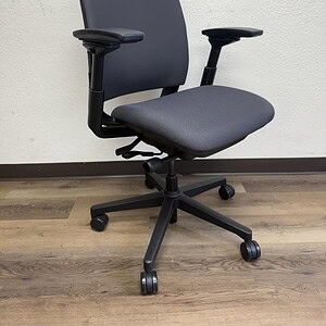 Modern ergonomic office chair with adjustable armrests and lumbar support.