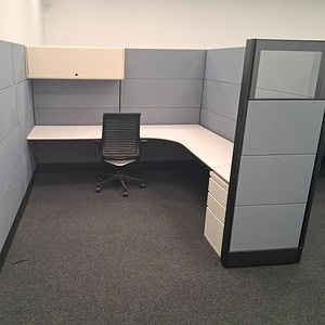 Ethospace 70-inch tall grey and black office cubicle with desk and privacy panels.