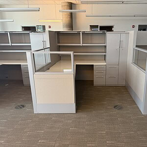 Haworth Compose glass-loaded L-shaped workstations, 65" tall, in various sizes for modern office env.