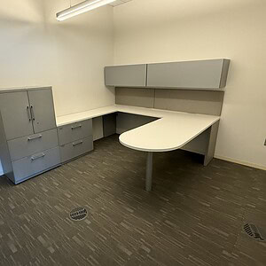 Modern Haworth U-shaped executive office set with storage and workspace.