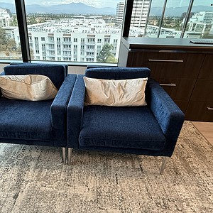 Blue lounge chairs for executive offices and modern interiors.