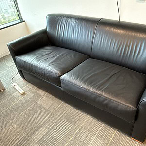 Black leather sofa for living room or office spaces. Comfortable, stylish, and durable for everyday.