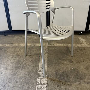 Aluminum outdoor stacker chair with armrests, ideal for patios, cafes, and commercial spaces. Durabl.