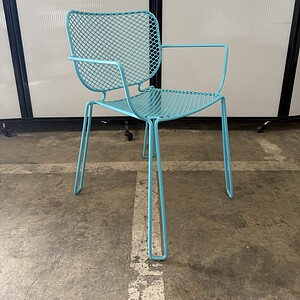 Bright blue Robbins Egg outdoor chair with metal frame and mesh design.