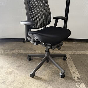 Herman Miller Celle black fabric office chair with graphite backrest.