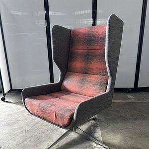 Elegant grey and sunset-colored swivel lounge chair with chrome base for modern interiors.
