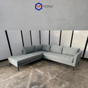 OFS sectional couch in light grey with black legs, 101" wide, perfect for modern living rooms.