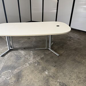 Herman Miller 7'x3' white race track top table with silver base.